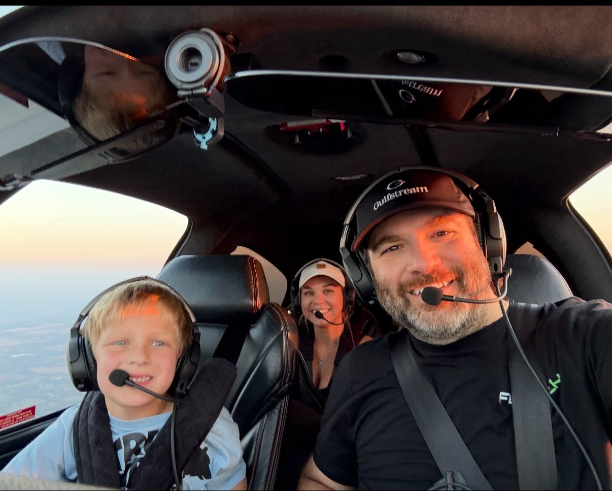 Lute Atieh piloting an aircraft with his family aboard
